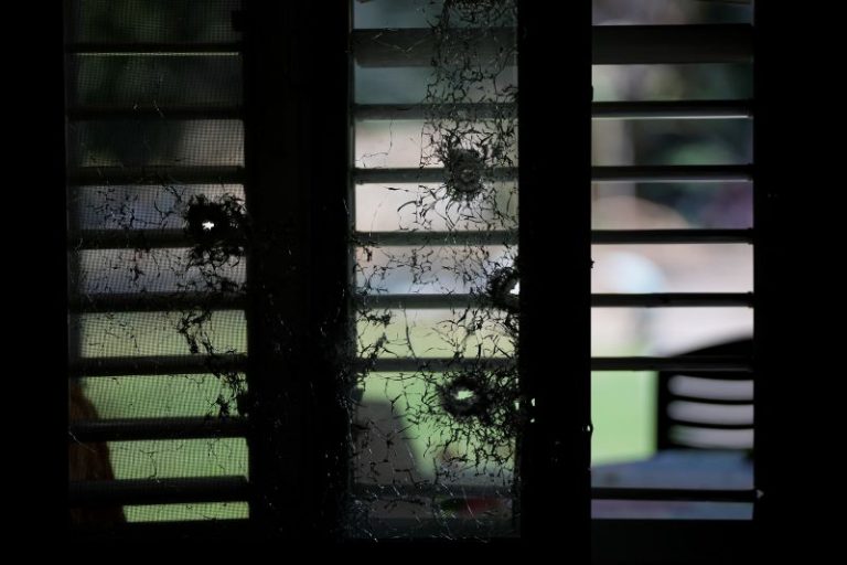 Bullet-shattered window of a house at Kibbutz Kfar Aza