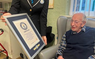 john-being-shown-his-certificate